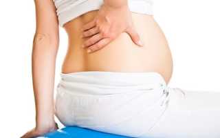 У беременной болит середина спины